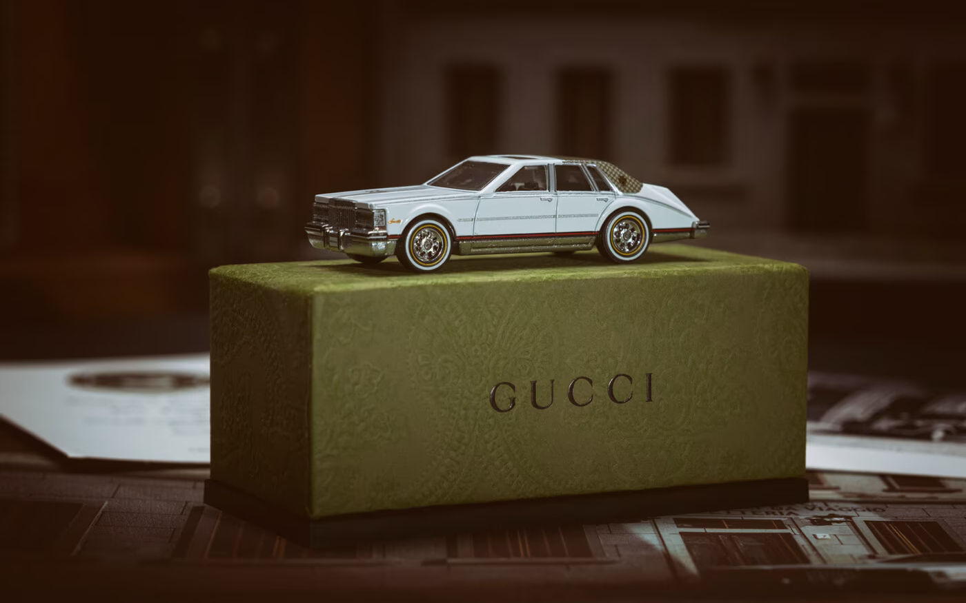 In celebration of the  gucci's centennial, Gucci has collaborated with Mattel Creations to create its first Hot Wheels collectible:
a replica of the Cadillac ‘Seville by Gucci,’ which was produced starting in the ‘70s.